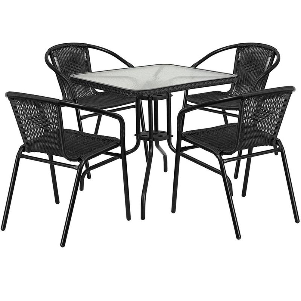 28 inch square glass metal table with rattan edging and 4 rattan stack chairs