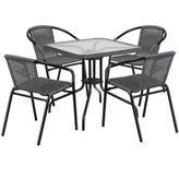 28 inch square glass metal table with rattan edging and 4 rattan stack chairs