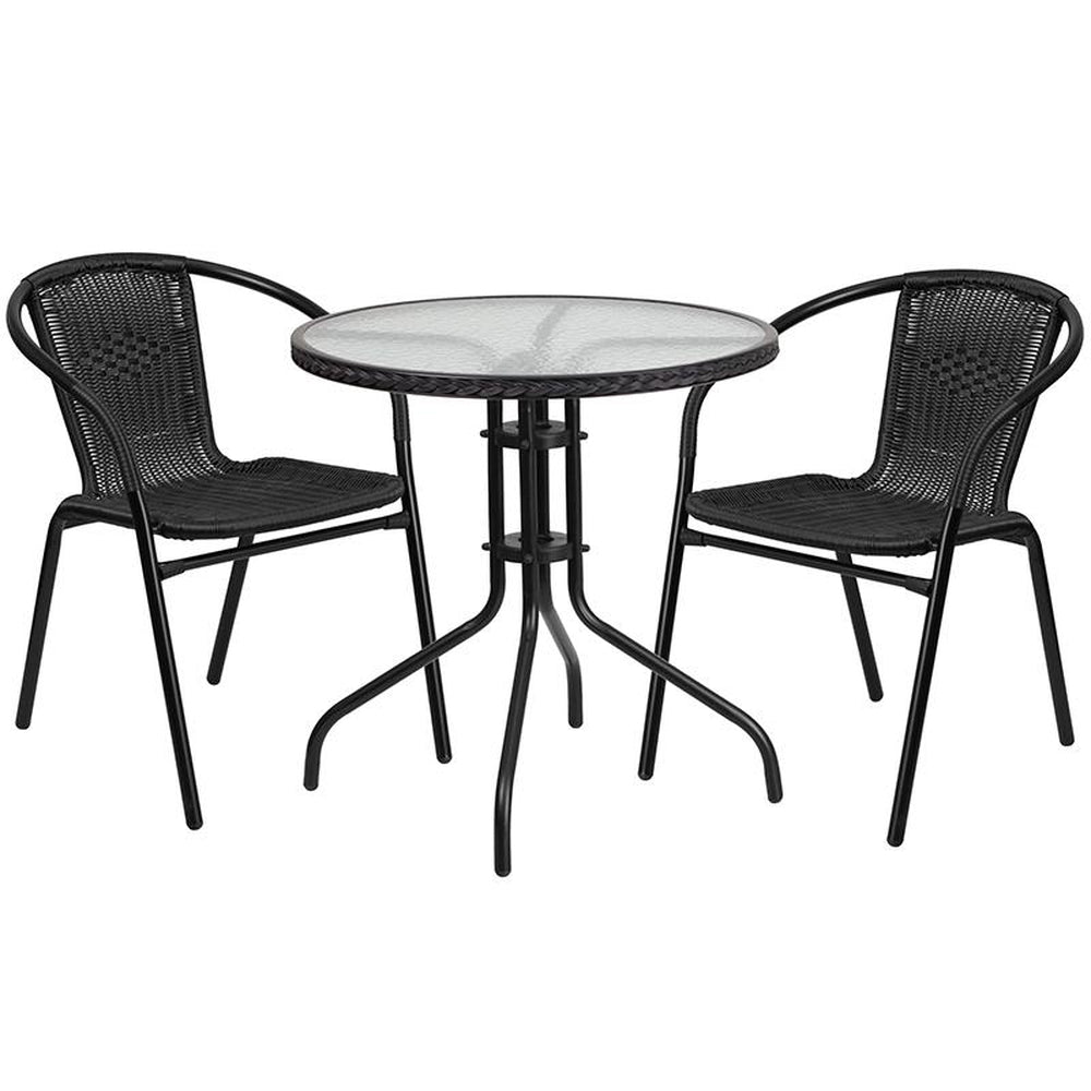 28 inch round glass metal table with black rattan edging and 2 black rattan stack chairs